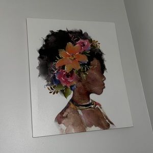 A beautiful picture of a black girl with flowers on her head